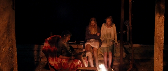 Wide shot frame from Kak menya zovut — sitting, book, standing