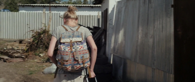 Wide shot frame from Kak menya zovut — walking, shirt, backpack