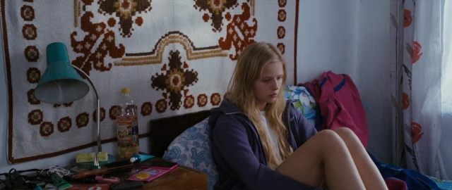 Wide shot frame from Kak menya zovut — sitting, room, table