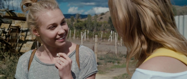 Wide shot frame from Kak menya zovut — standing, dialogue, hand