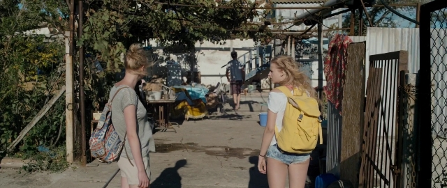 Wide shot frame from Kak menya zovut — walking, table, shirt