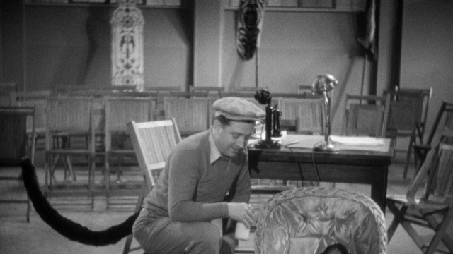 Wide shot frame from Footlight Parade — sitting, room, table