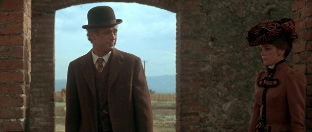 Wide shot frame from Butch Cassidy and the Sundance Kid — standing, hat, coat
