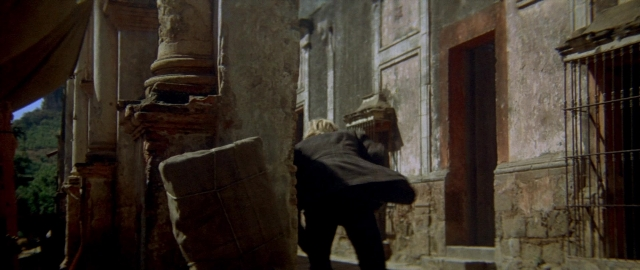 Wide shot frame from Butch Cassidy and the Sundance Kid — walking, coat, person