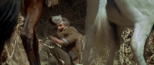 Wide shot frame from Butch Cassidy and the Sundance Kid — standing, dialogue, bed