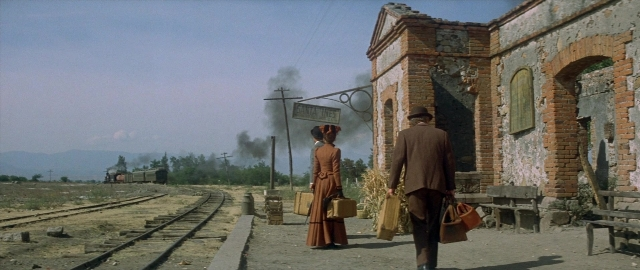 Wide shot frame from Butch Cassidy and the Sundance Kid — walking, hat, coat