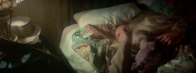 Wide shot frame from Butch Cassidy and the Sundance Kid — room, bed, hat
