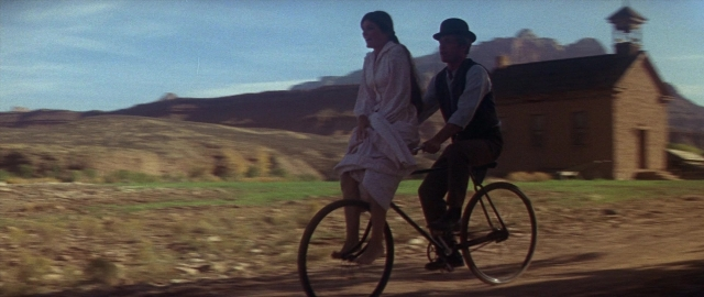 Wide shot frame from Butch Cassidy and the Sundance Kid — street, hat, dress
