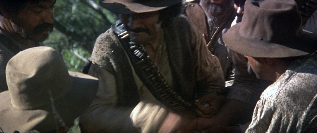 Wide shot frame from Butch Cassidy and the Sundance Kid — dialogue, hat, coat