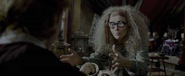 Wide shot frame from Harry Potter and the Prisoner of Azkaban — sitting, standing, room