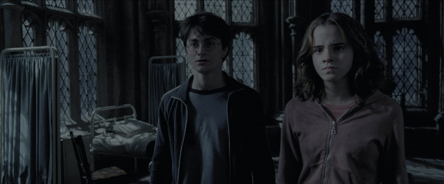 Wide shot frame from Harry Potter and the Prisoner of Azkaban — standing, room, bed