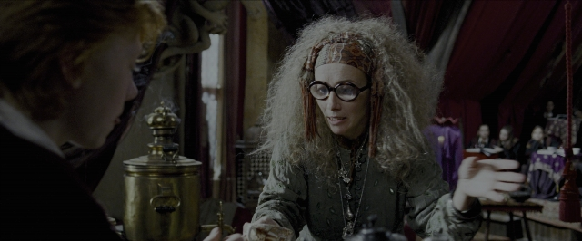 Wide shot frame from Harry Potter and the Prisoner of Azkaban — sitting, room, table