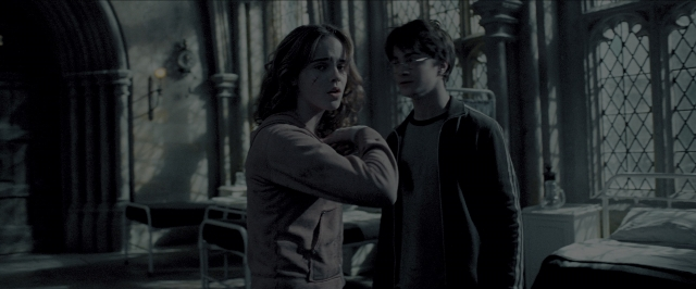 Wide shot frame from Harry Potter and the Prisoner of Azkaban — standing, room, bed