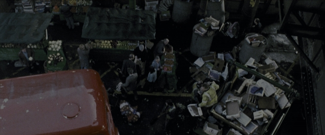 Wide shot frame from Harry Potter and the Prisoner of Azkaban — sitting, standing, bag