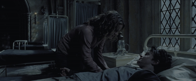 Wide shot frame from Harry Potter and the Prisoner of Azkaban — standing, room, bed