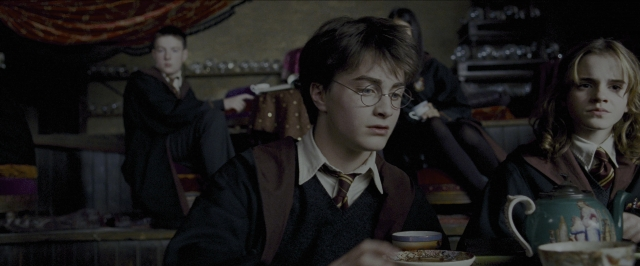 Wide shot frame from Harry Potter and the Prisoner of Azkaban — sitting, plate, room