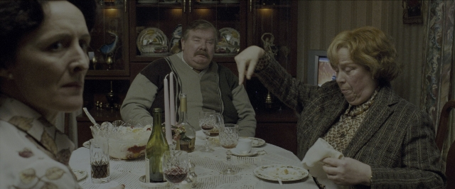 Medium shot frame from Harry Potter and the Prisoner of Azkaban — sitting, room, table