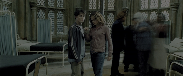 Wide shot frame from Harry Potter and the Prisoner of Azkaban — standing, room, dialogue