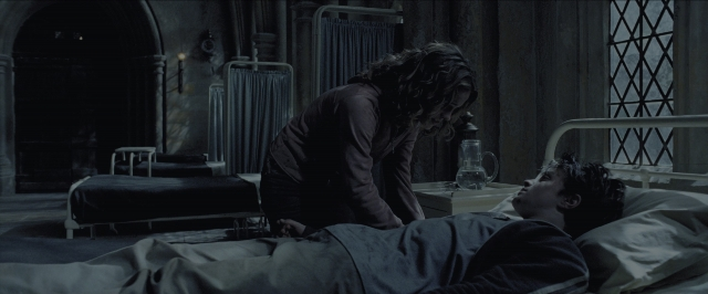 Wide shot frame from Harry Potter and the Prisoner of Azkaban — standing, room, table