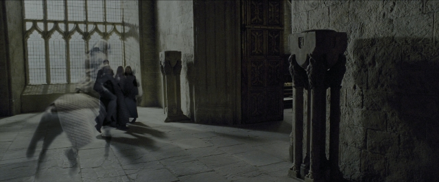 Wide shot frame from Harry Potter and the Prisoner of Azkaban — sitting, room, dialogue