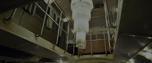 Wide shot frame from Harry Potter and the Prisoner of Azkaban — car, glass, train