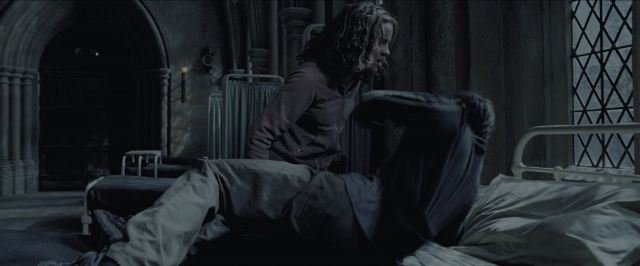 Wide shot frame from Harry Potter and the Prisoner of Azkaban — sitting, room, bed