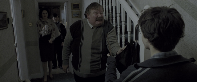 Wide shot frame from Harry Potter and the Prisoner of Azkaban — standing, walking, door