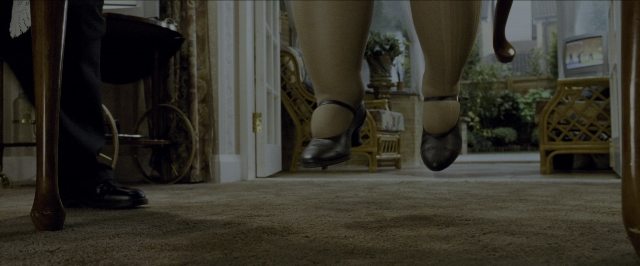 Wide shot frame from Harry Potter and the Prisoner of Azkaban — walking, door, chair