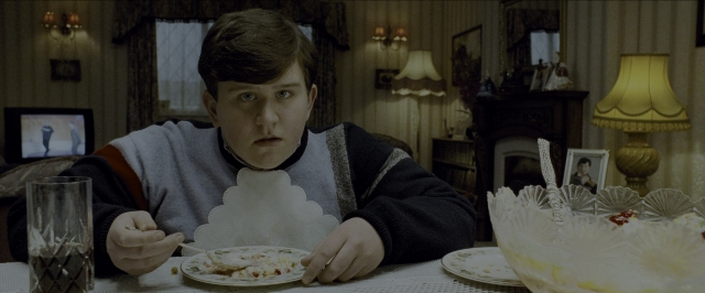 Wide shot frame from Harry Potter and the Prisoner of Azkaban — sitting, plate, room