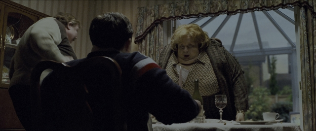 Wide shot frame from Harry Potter and the Prisoner of Azkaban — sitting, plate, room