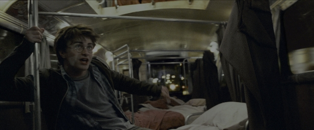 Wide shot frame from Harry Potter and the Prisoner of Azkaban — sitting, bed, car