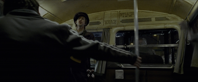 Wide shot frame from Harry Potter and the Prisoner of Azkaban — standing, night, bus
