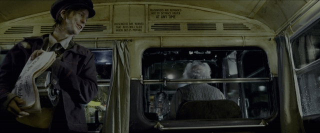 Wide shot frame from Harry Potter and the Prisoner of Azkaban — sitting, standing, hat