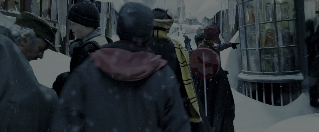 Wide shot frame from Harry Potter and the Prisoner of Azkaban — walking, street, hat