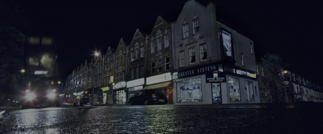 Wide shot frame from Harry Potter and the Prisoner of Azkaban — street, night, water