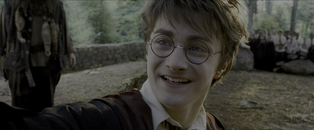 Close-up frame from Harry Potter and the Prisoner of Azkaban — sitting, walking, shirt