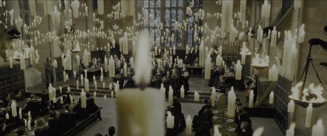Wide shot frame from Harry Potter and the Prisoner of Azkaban — sitting, standing, room