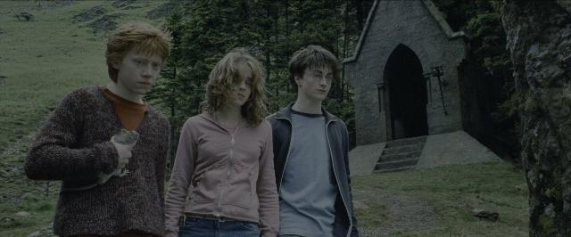 Wide shot frame from Harry Potter and the Prisoner of Azkaban — standing, hand, jacket