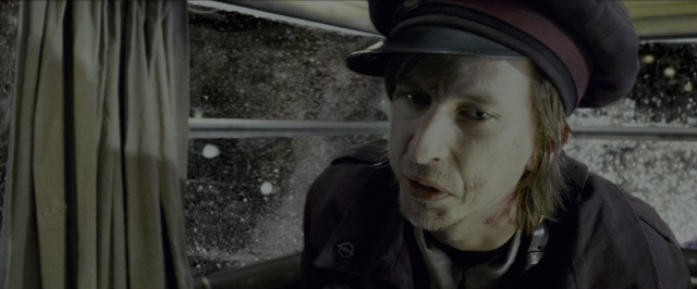 Wide shot frame from Harry Potter and the Prisoner of Azkaban — sitting, face, train