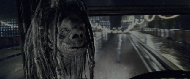 Wide shot frame from Harry Potter and the Prisoner of Azkaban — street, car, night