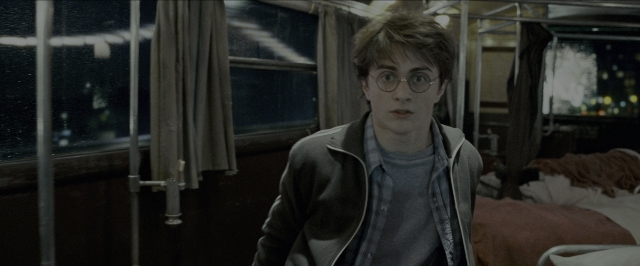 Wide shot frame from Harry Potter and the Prisoner of Azkaban — standing, room, bed