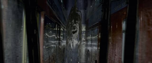 Wide shot frame from Harry Potter and the Prisoner of Azkaban — car, face, train
