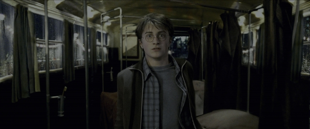 Medium shot frame from Harry Potter and the Prisoner of Azkaban — standing, bed, car