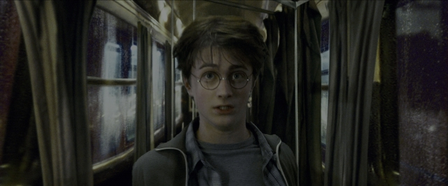 Medium shot frame from Harry Potter and the Prisoner of Azkaban — standing, car, face