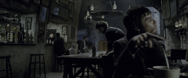 Wide shot frame from Harry Potter and the Prisoner of Azkaban — sitting, room, table