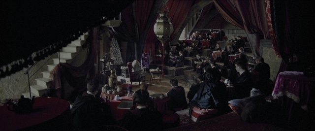 Wide shot frame from Harry Potter and the Prisoner of Azkaban — sitting, standing, room