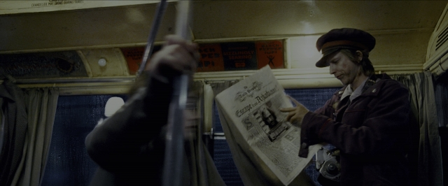 Wide shot frame from Harry Potter and the Prisoner of Azkaban — standing, hat, face