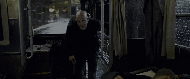Wide shot frame from Harry Potter and the Prisoner of Azkaban — standing, face, bag