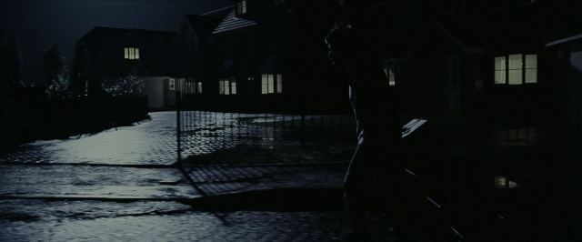Wide shot frame from Harry Potter and the Prisoner of Azkaban — standing, walking, street
