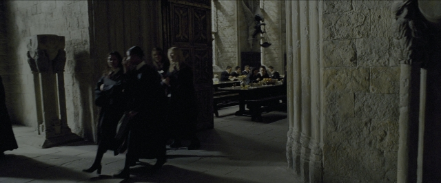 Wide shot frame from Harry Potter and the Prisoner of Azkaban — room, table, dialogue